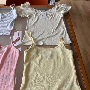 8 Tank tops many with tags size m.  Sell as bundle $80 or individual $15